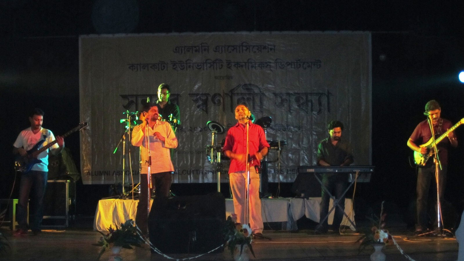 Six members of the Bengali band Chandrabindoo performing on a lit stage in Kolkata in 2010