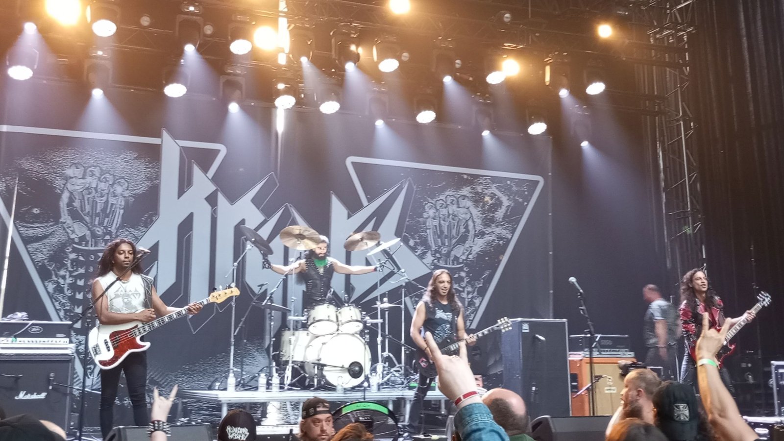 Kryptos playing live at Huginns Awakening Fest 2024 in Ostend, Belgium, with the band logo on the backdrop
